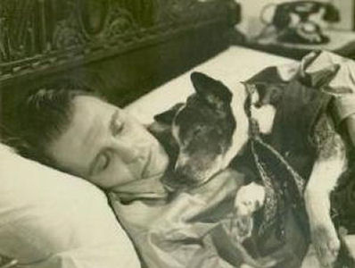 Ralph Bellamy and a furry friend in an early film